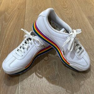 Puma white sneakers with Pride bottom.